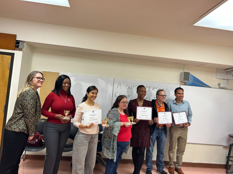 District 119 Director Emily Sachs, left, with the Area 32 Humorous and Evaluation Speech Competitors.